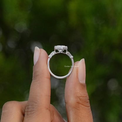 Side view of sterling silver ring showing raised stone setting and detailed shoulders