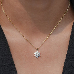 View of Round Cut Diamond Floral Minimalist Pendant In Yellow Gold