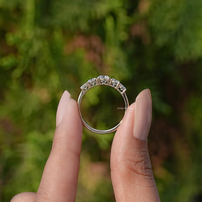 Back View of Round Cut Lab Diamond Five Stone Ring In two fingers