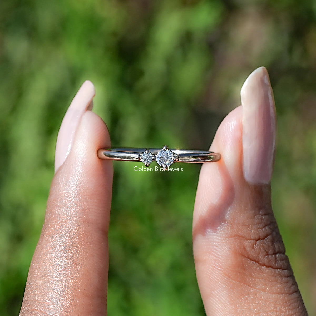 Front View of Round Cut Lab Diamond Solitare Ring In two Fingers