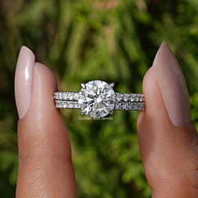 Front View of A Round Cut Lab Diamond Wedding Ring In two fingers
