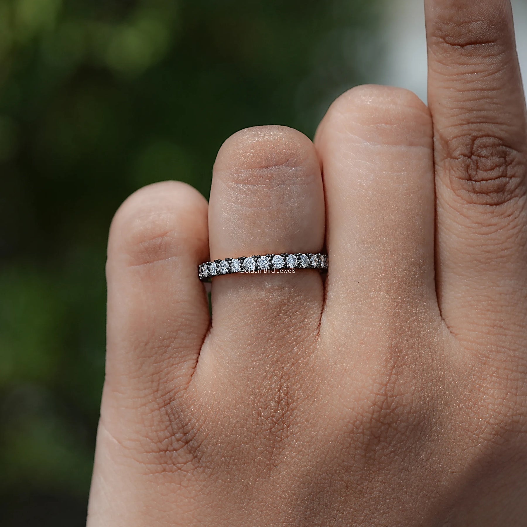 In finger view of Round Cut Moissanite Solitaire Ring