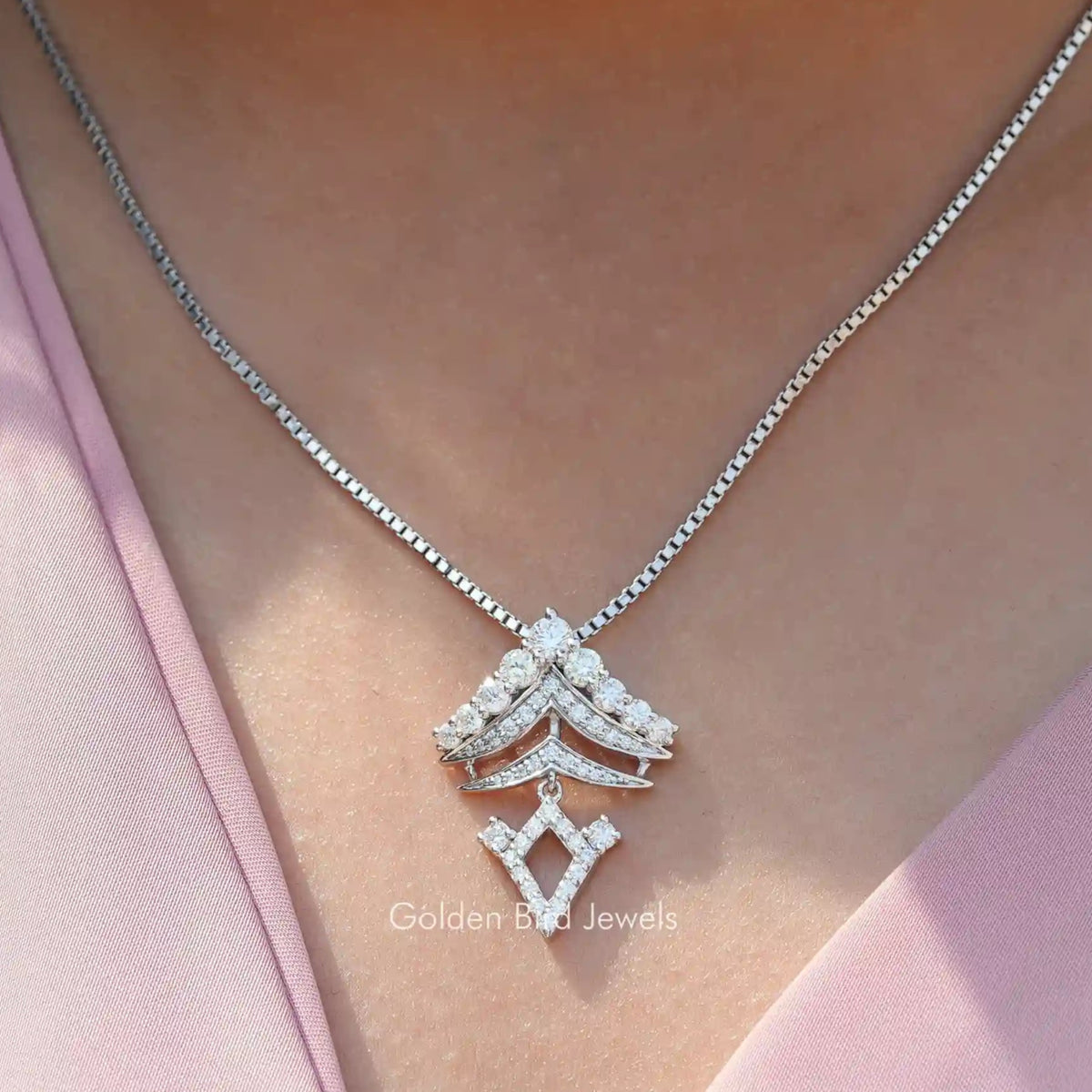 View of round cut moissanite solitaire pendant 