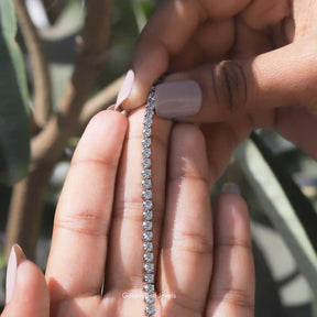 View of moissanite round bracelet for women in secure setting 