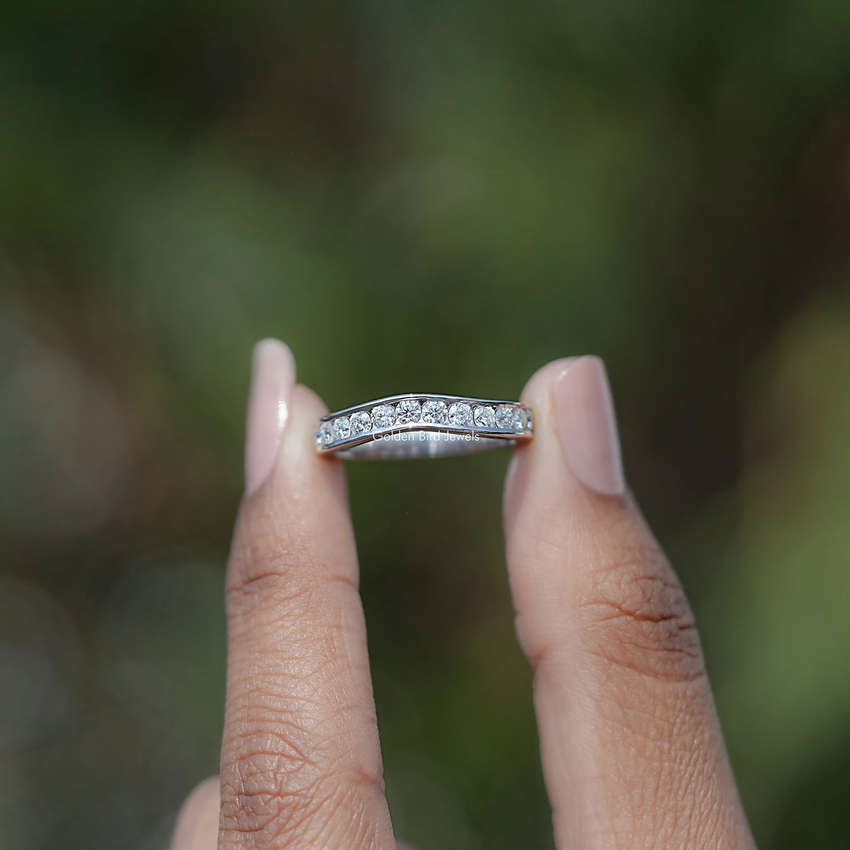 Front view of Round Cut Channel Set Moissanite Wedding Band