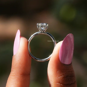 Back View of Round Cut Moissanite Engagement Ring In two fingers