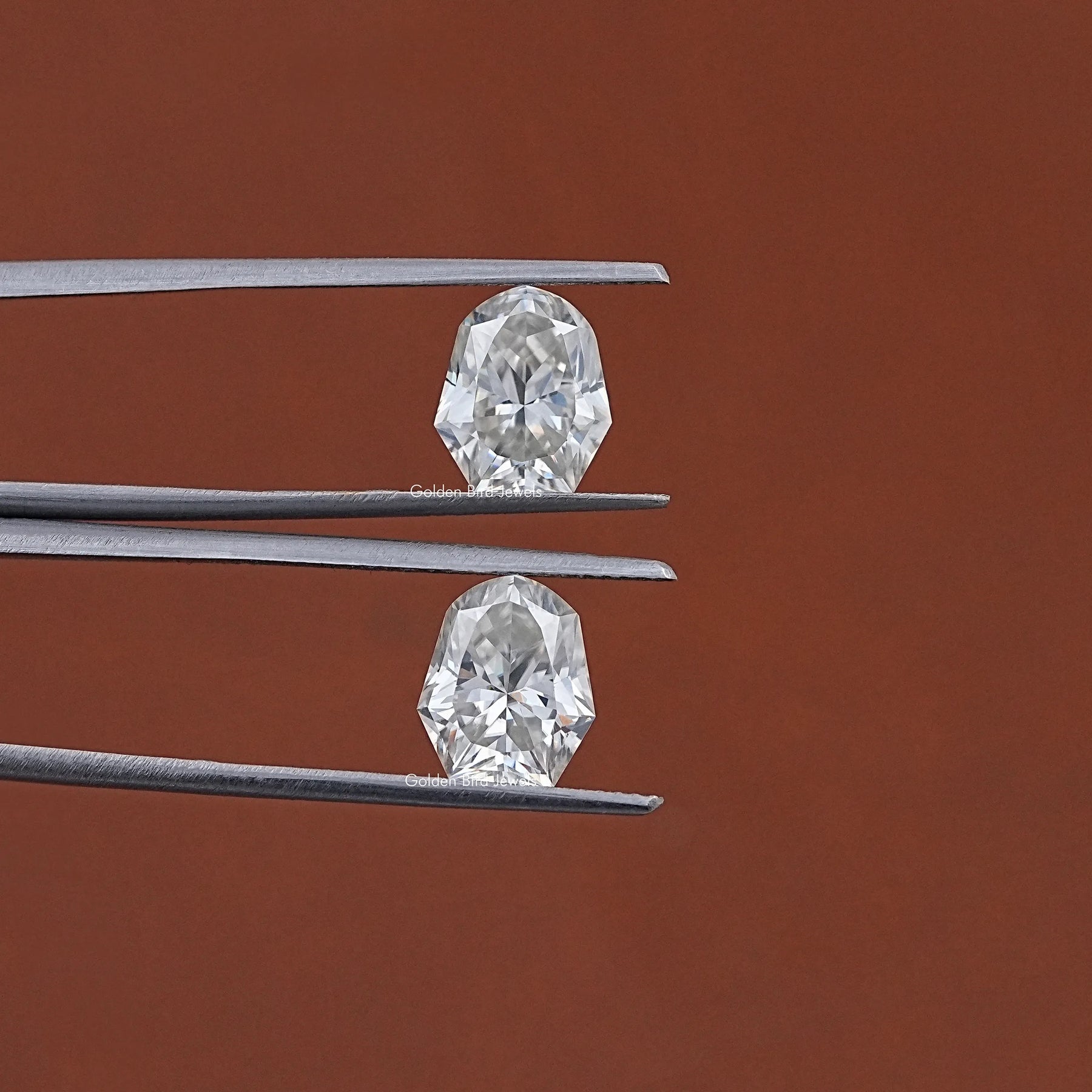 In Tweezer View Of Shield Cut Loose Moissanite Pair 