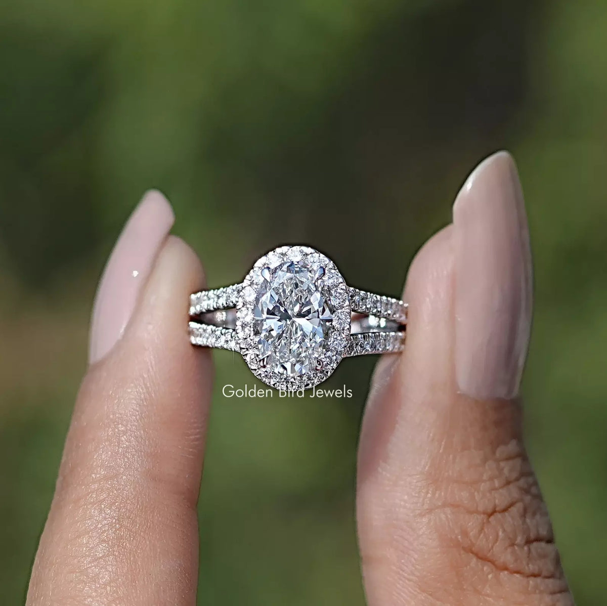 Front view of Diamond Split Shank Engagement Ring holding in two fingers 