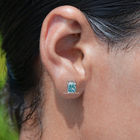 In Ear view of Blue elongated cushion Cut moissanite Stud Earrings