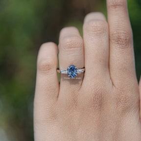 In finger front view of halo Oval Moissanite engagement ring 
