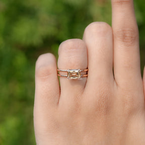 In finger front view of East West Criss Cut Moissanite engagement ring 