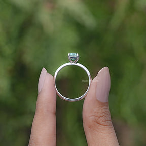 Back view of Green Emerald Cut ring in secure setting 