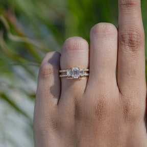 In finger front view of Emerald Cut Moissanite engagement ring 
