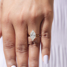 In finger front view of prong setting marquise shaped solitaire ring
