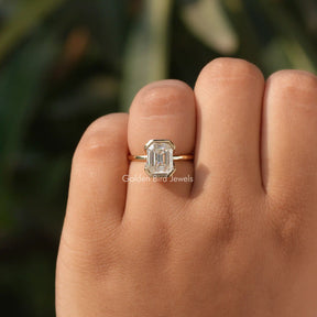 View of Emerald Cut Bezel Set Engagement Ring In Yellow Gold