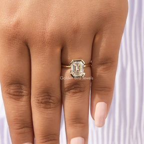 View of Bezel Set Emerald Cut Moissanite Ring In Yellow Gold