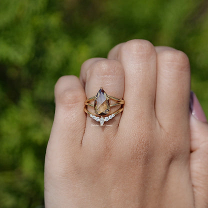 Gold-tone pear-cut solitaire-style ring with double band settings