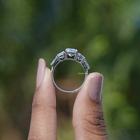 Back View of Cushion And Tapered Baguette Cut Five Stone Ring In two fingers