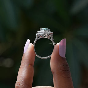 Back View of Step Cut Moissanite Milgrain Halo Ring In two fingers