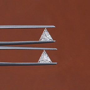 In Tweezer View Of Triangle Cut Loose Moissanite Matching Pair
