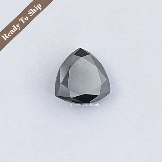 Trillion-cut dark gray moissanite loose gemstone with faceted edges