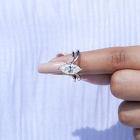 In finger front view of Marquise Cut Moissanite Solitaire Chevron Ring in unique shape