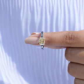In finger front view of East West Yellow Radiant moissanite Solitaire Ring  in unique shape
