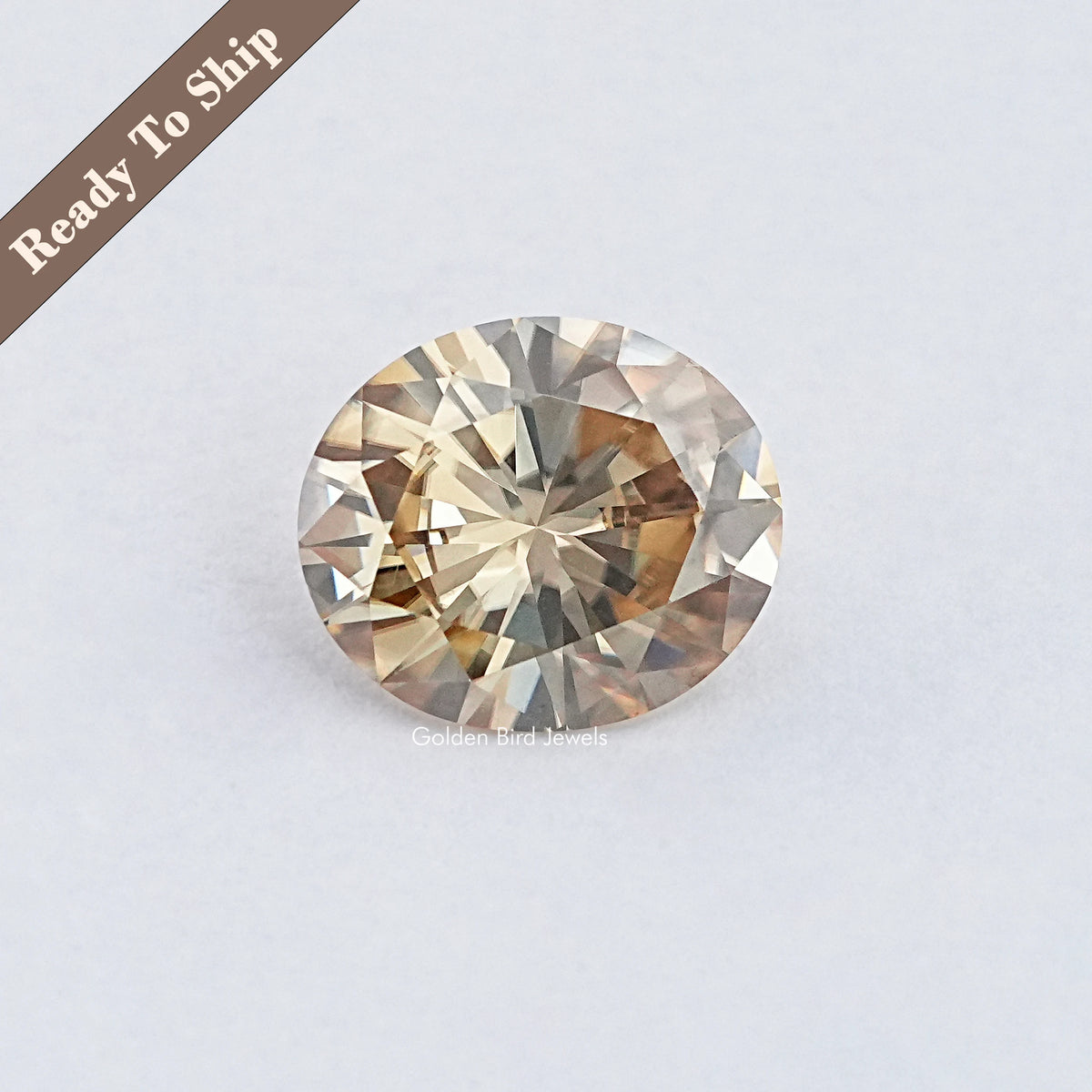 Oval-cut yellow-tinted moissanite gemstone with faceted sparkle