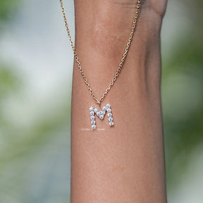 Close View Of M Letter moissanite pendant in Secure Setting 