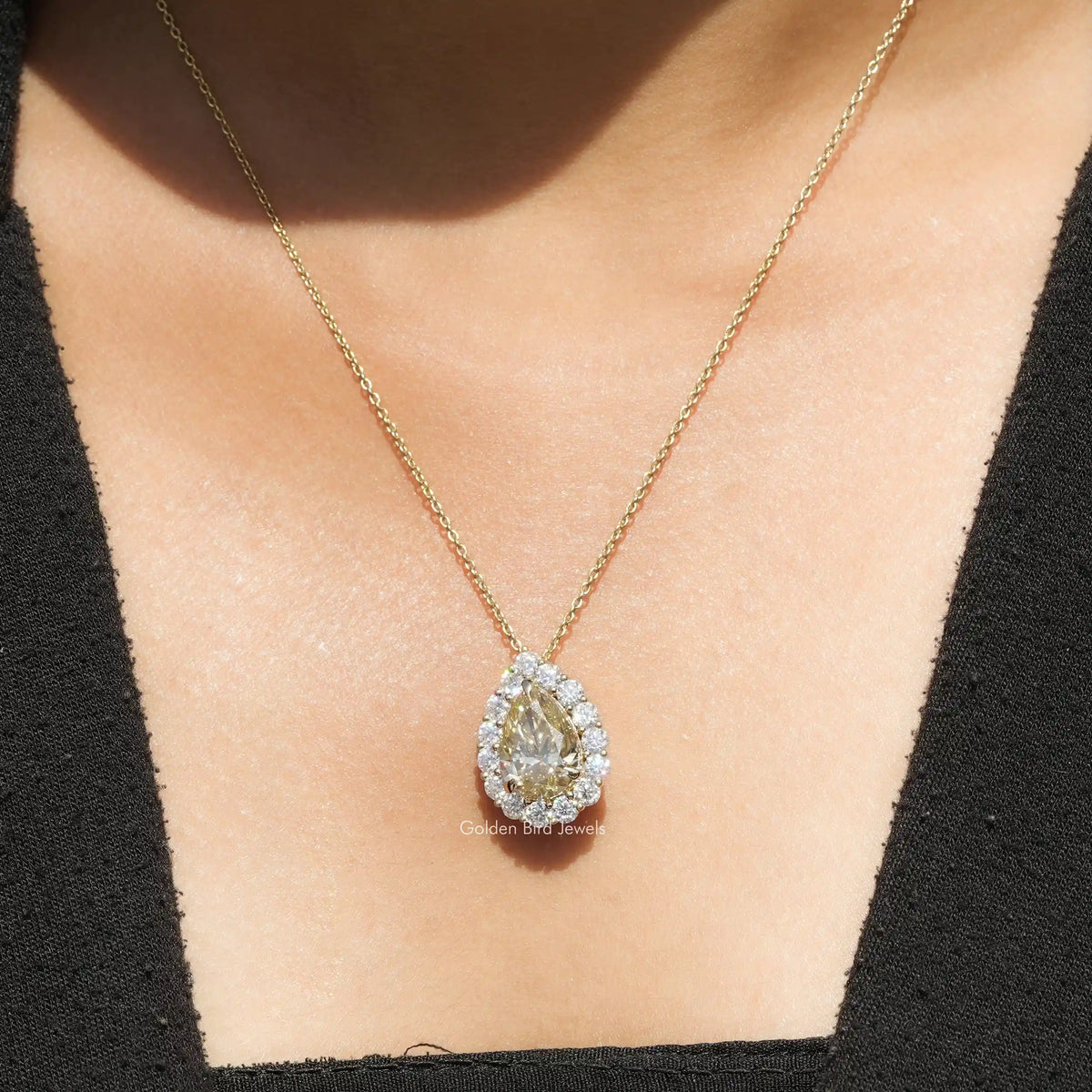 View of yellow Pear moissanite solitaire pendant 