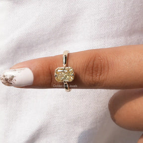 In front finger view of moissanite  halo engagement ring
