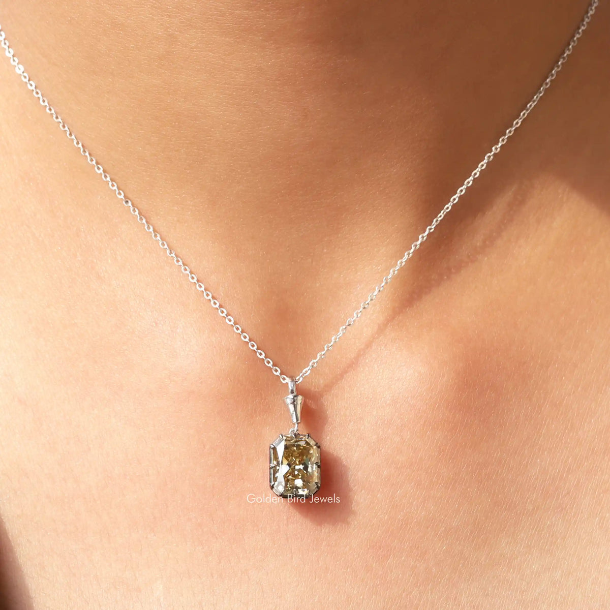 View of yellow Radiant moissanite cut solitaire pendant 