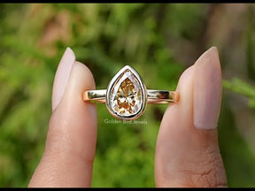 You tube Video Of Pear Cut Yellow Moissanite Bezel Set Solitaire Ring