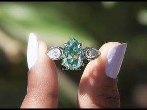 YouTube Video Of Blue Old Mine Pear Cut Moissanite 3 Stone Ring
