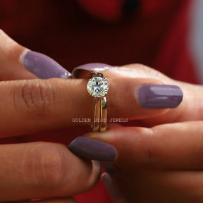 In finger front view of Round Cut Moissanite Solitaire Ring In white gold