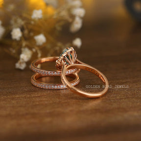 Back view of a pear-cut blue stone ring in prongs setting 