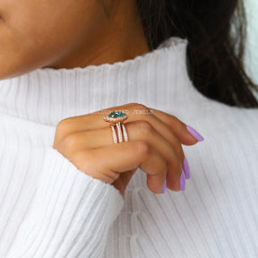 In a finger Side view of moissanite  Wedding ring in blue pear