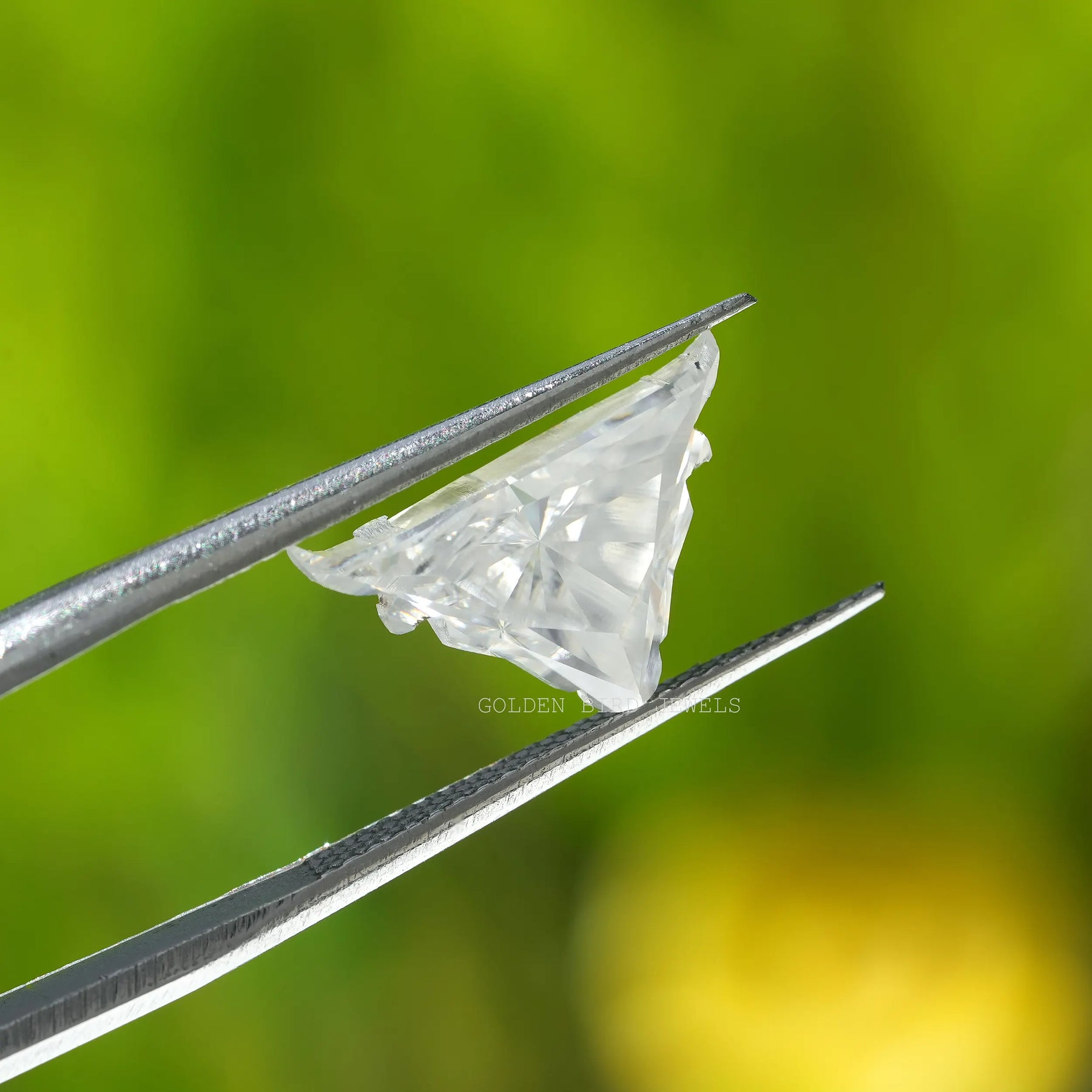 In tweezer View  of colorless antique shape moissanite Stone