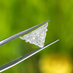 In tweezer View  of colorless antique shape moissanite Stone