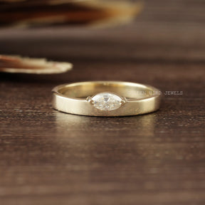 View of Marquise Cut Solitaire Moissanite Ring In Yellow Gold