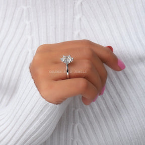 Hexagon Cut Solitaire Engagement Ring In Finger
