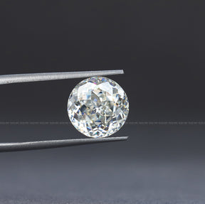 In Tweezer View Of Portuguese Cut Round Loose Moissanite