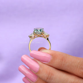 Back view of cushion cut moissanite   ring in two fingers 