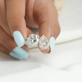 Front View of Pear and Round Cut Toi Et Moi Ring In two Fingers
