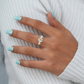 View of Moissanite Three Stone Round Cut Engagement Ring In Finger