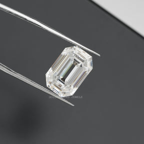 Tweezer view of Old Mine Emerald Cut Loose moissanite