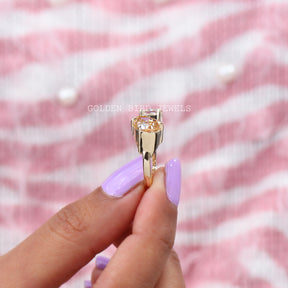 Yellow gold radiant cut moissanite  open ring in secure setting 