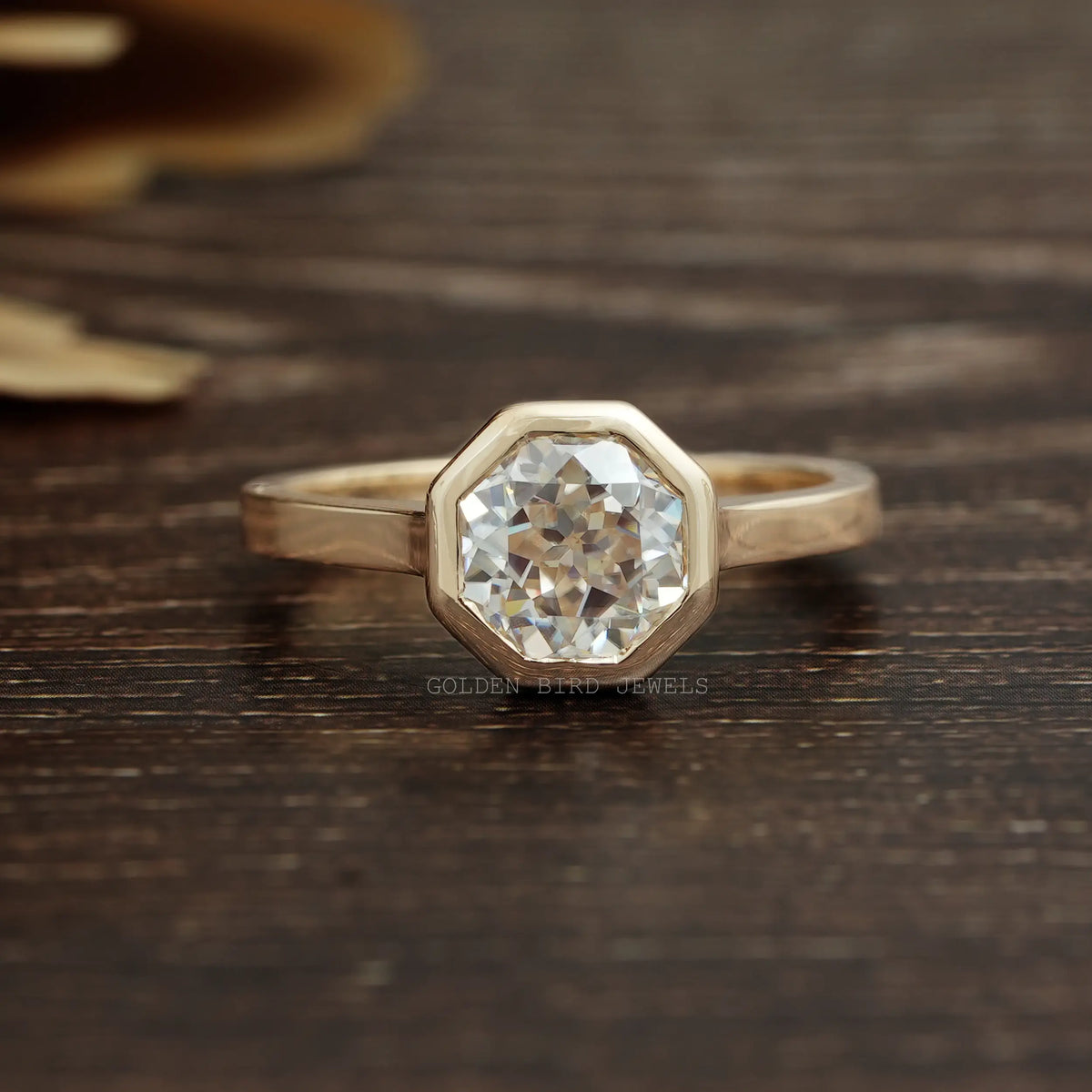View of Colorless Octagon Cut Moissanite Ring In Yellow Gold