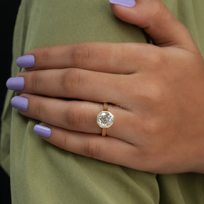 View of Solitaire Octagon Cut Moissanite Bezel Set Ring In Finger