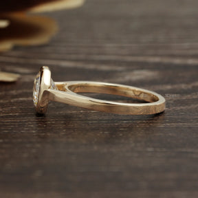 View of Bezel Set Octagon Cut Solitaire Moissanite Ring In 14K Yellow Gold